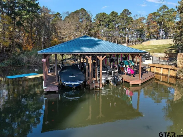 a small pool with lawn chairs