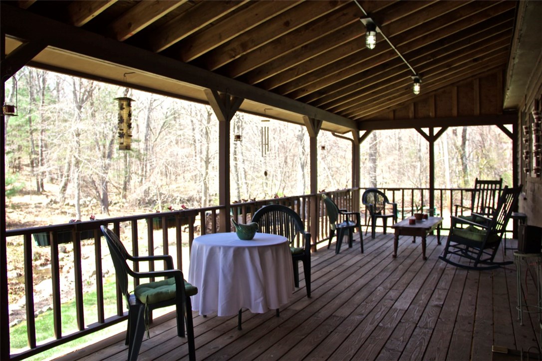 291 Widow Sweets Road Exeter, RI 02822 - Photo 23 of 27 Porch off family room overlooking stone walls and running stream.