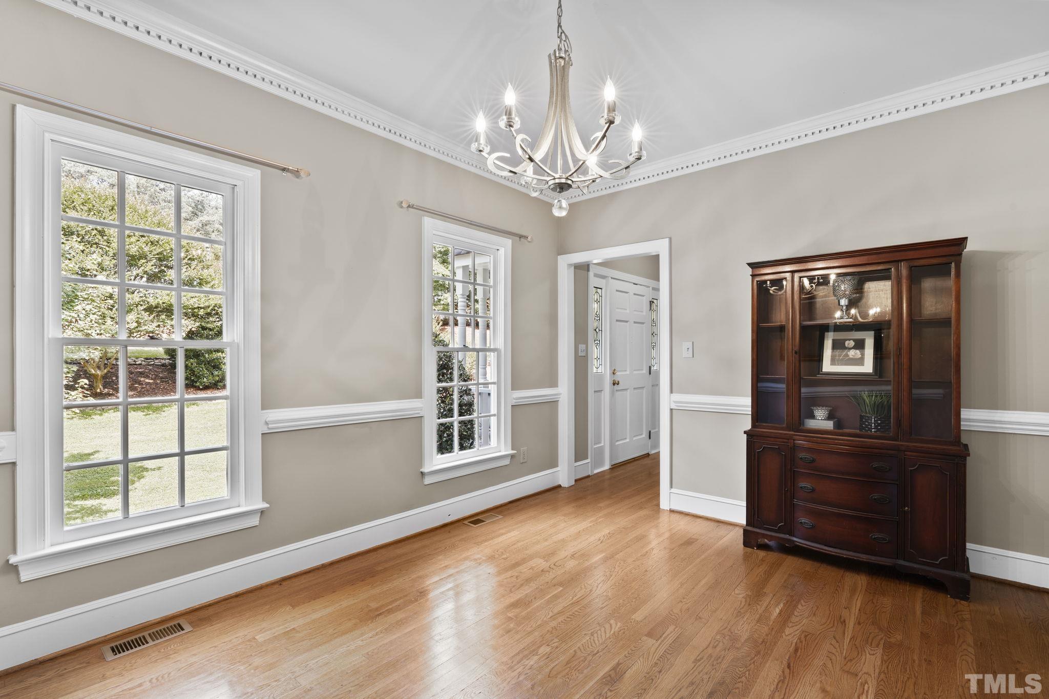 2821 Patrie Place Raleigh, NC 27613 - Photo 12 of 62 a living room with furniture and a wooden floor