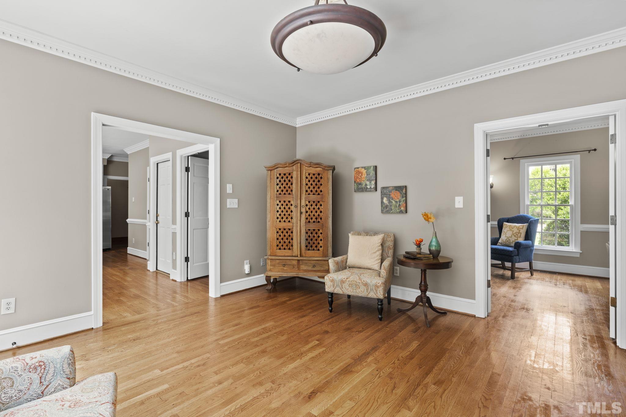 2821 Patrie Place Raleigh, NC 27613 - Photo 17 of 62 a living room with furniture and a wooden floor