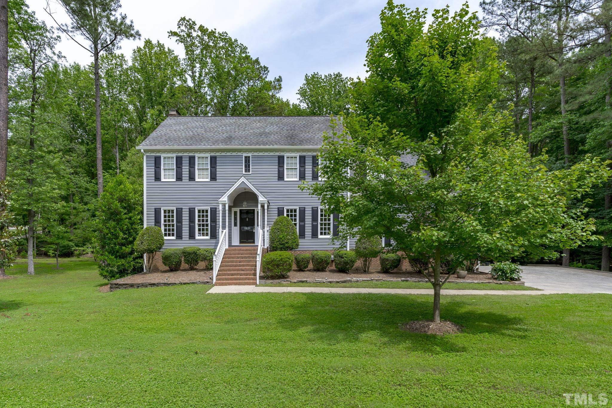 2821 Patrie Place Raleigh, NC 27613 - Photo 2 of 62 a front view of a house with a yard