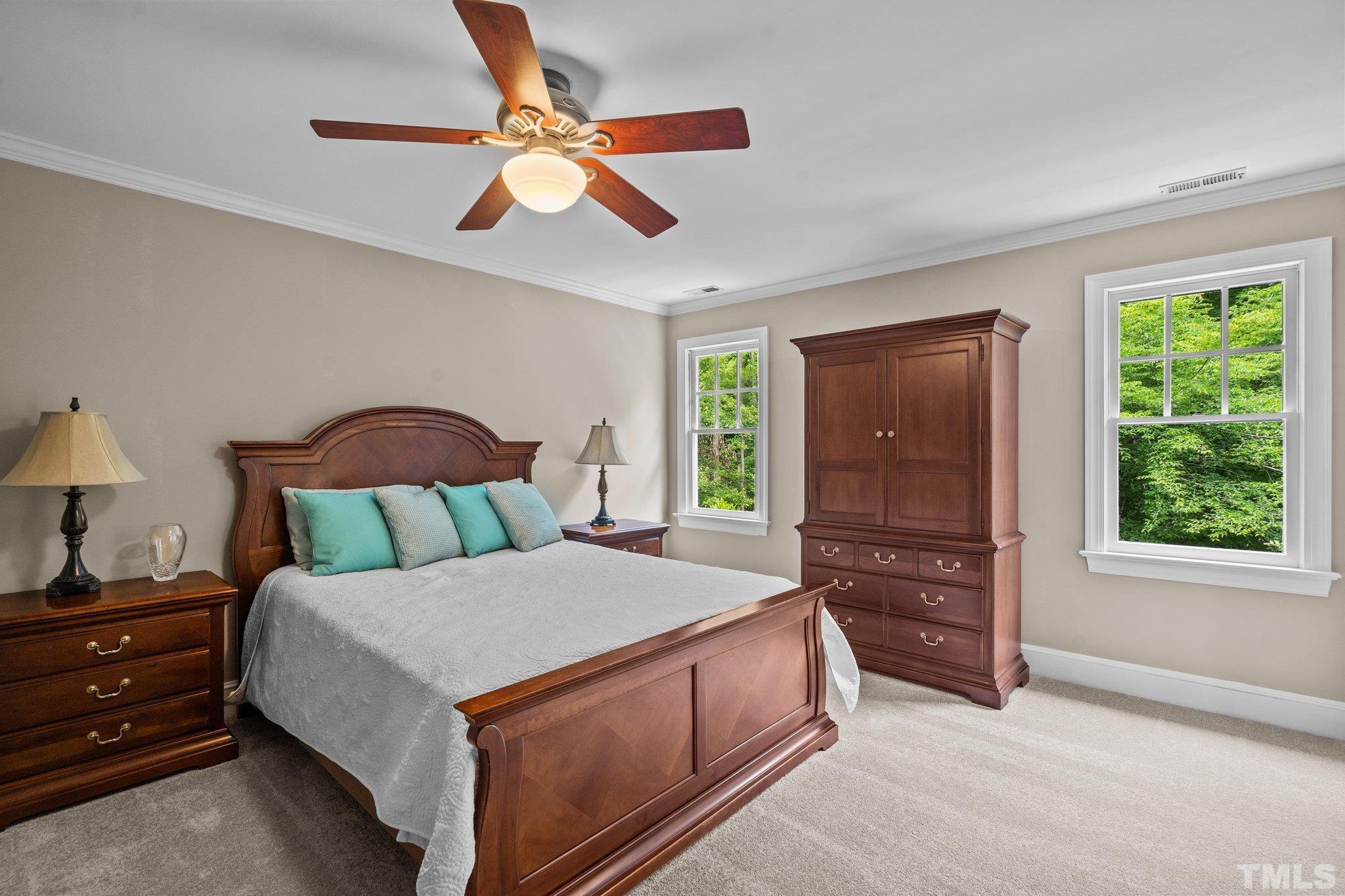 2821 Patrie Place Raleigh, NC 27613 - Photo 35 of 62 a bed room with a bed and a dresser
