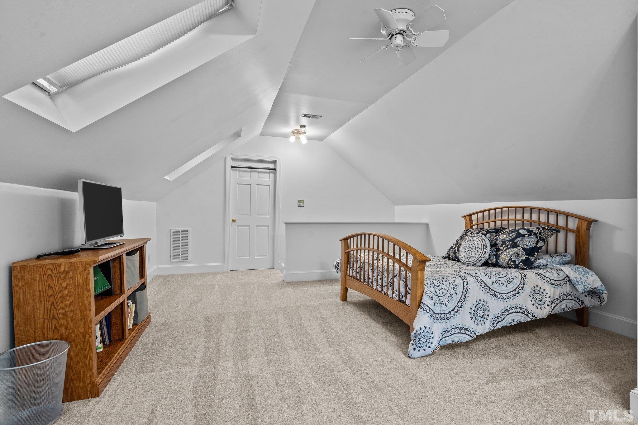 2821 Patrie Place Raleigh, NC 27613 - Photo 45 of 62 a bedroom with a bed and a couch