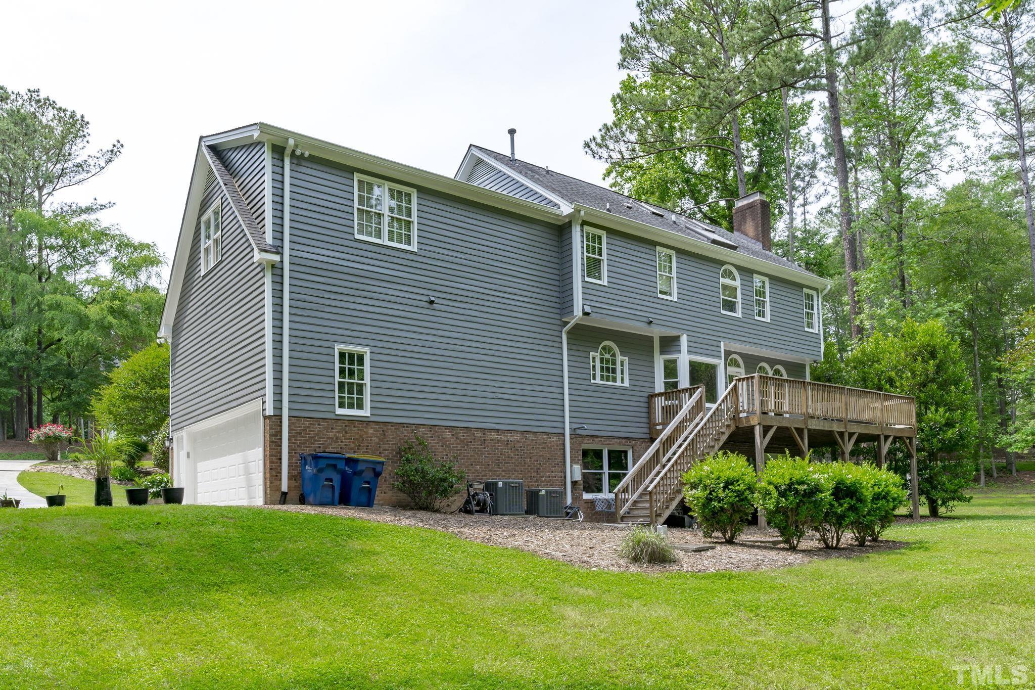 2821 Patrie Place Raleigh, NC 27613 - Photo 46 of 62 a front view of a house with a yard