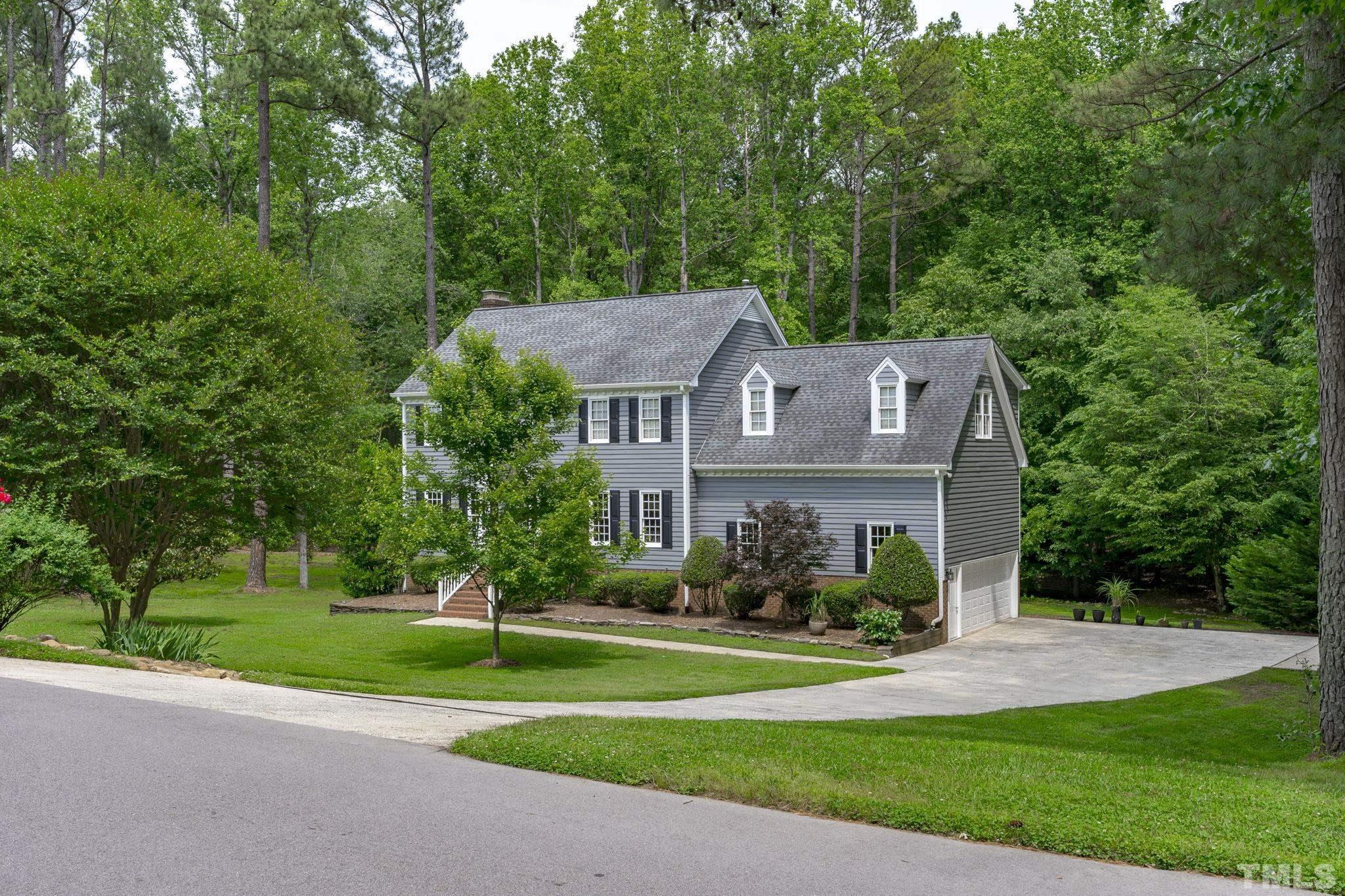 2821 Patrie Place Raleigh, NC 27613 - Photo 8 of 62 a front view of house with yard and green space