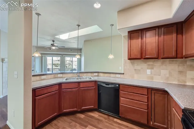 a kitchen with a sink and cabinets