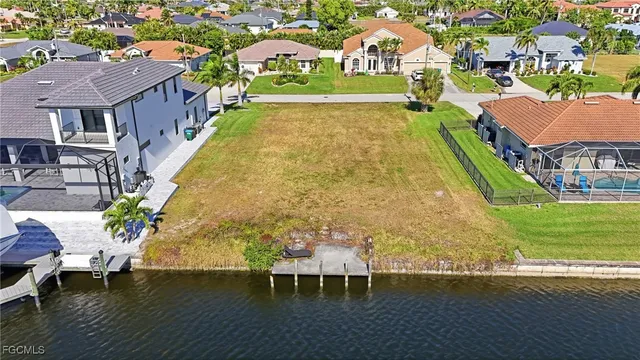 a view of a swimming pool with a table and chairs