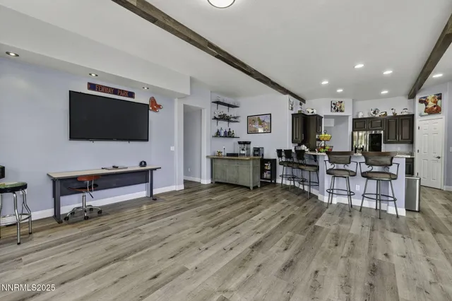 a kitchen with stainless steel appliances granite countertop a refrigerator and a sink