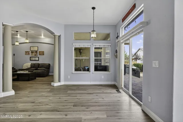 a kitchen with stainless steel appliances kitchen island granite countertop a stove refrigerator and cabinets
