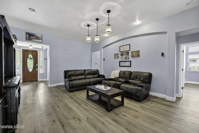 a bedroom with a bed and a television