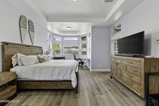 a bedroom with a bed and a couch