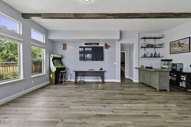 a kitchen with stainless steel appliances a refrigerator and a stove top oven