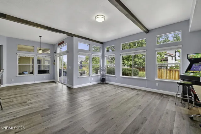 a kitchen with stainless steel appliances kitchen island granite countertop a refrigerator stove and sink