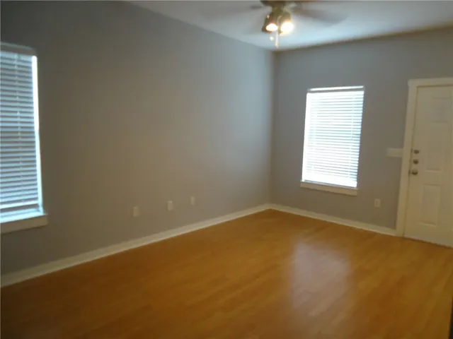 a view of an empty room with a window