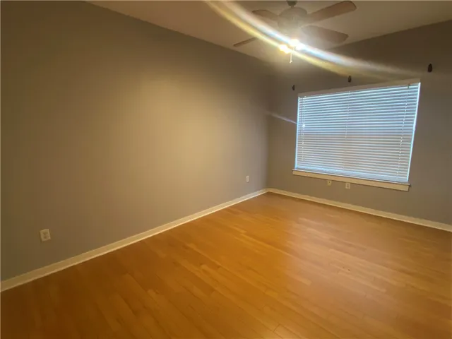 an empty room with a empty space and windows