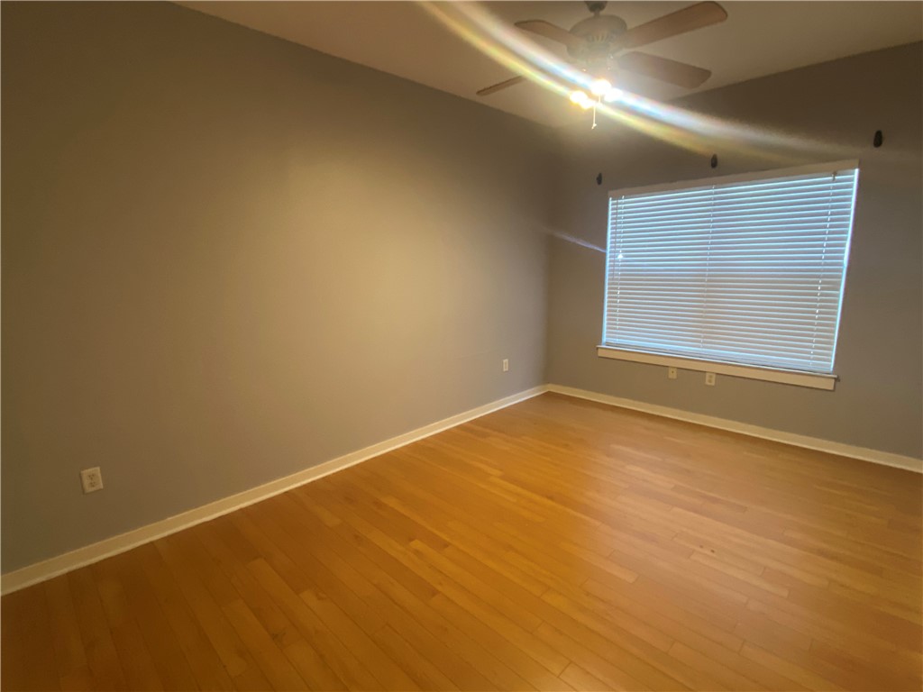 2106 Cullen Avenue, Unit 102 Austin, TX 78757 - Photo 10 of 11 an empty room with a empty space and windows