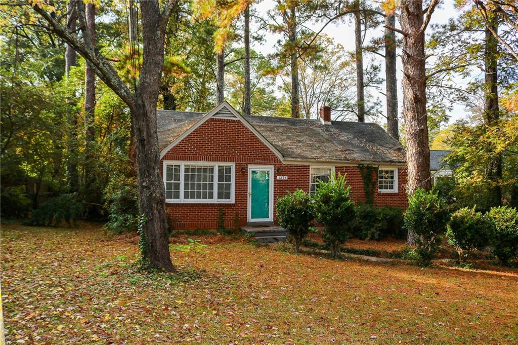 1275 Oldfield Road Decatur, GA 30030 - Photo 1 of 1 a front view of a house with a yard