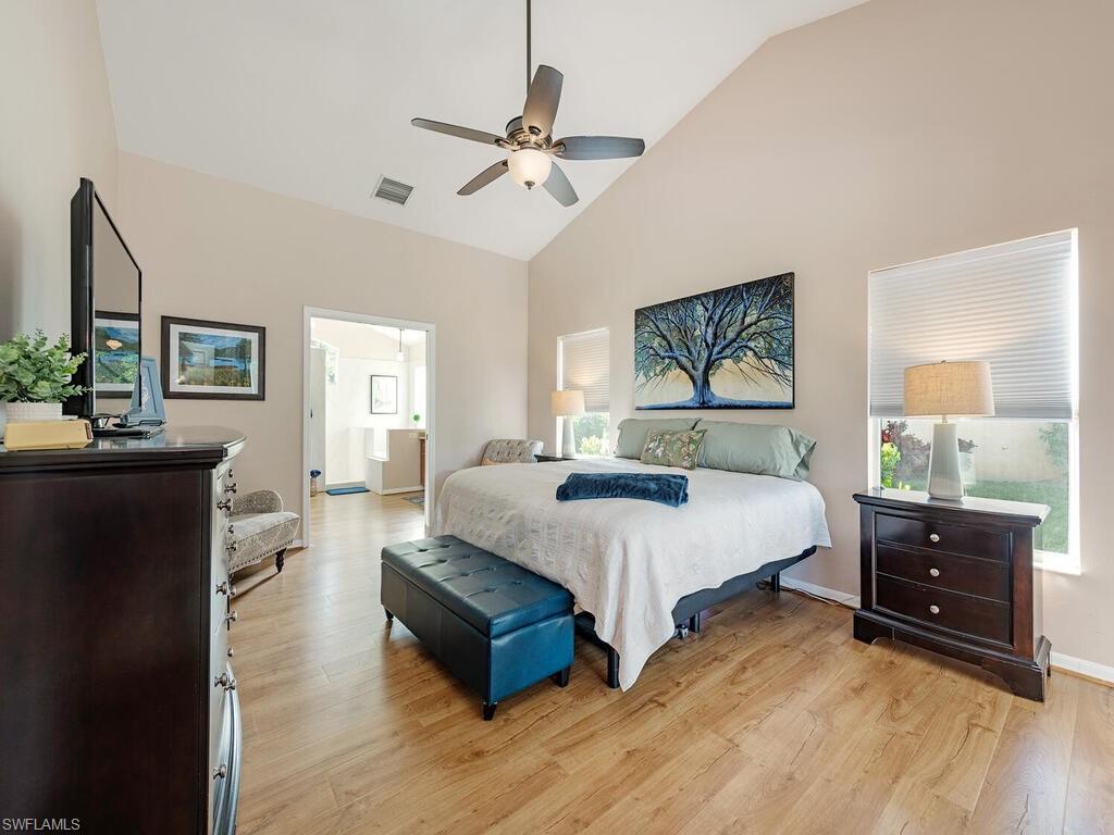 579 Raven Way Naples, FL 34110 - Photo 8 of 19 a spacious bedroom with a bed and window