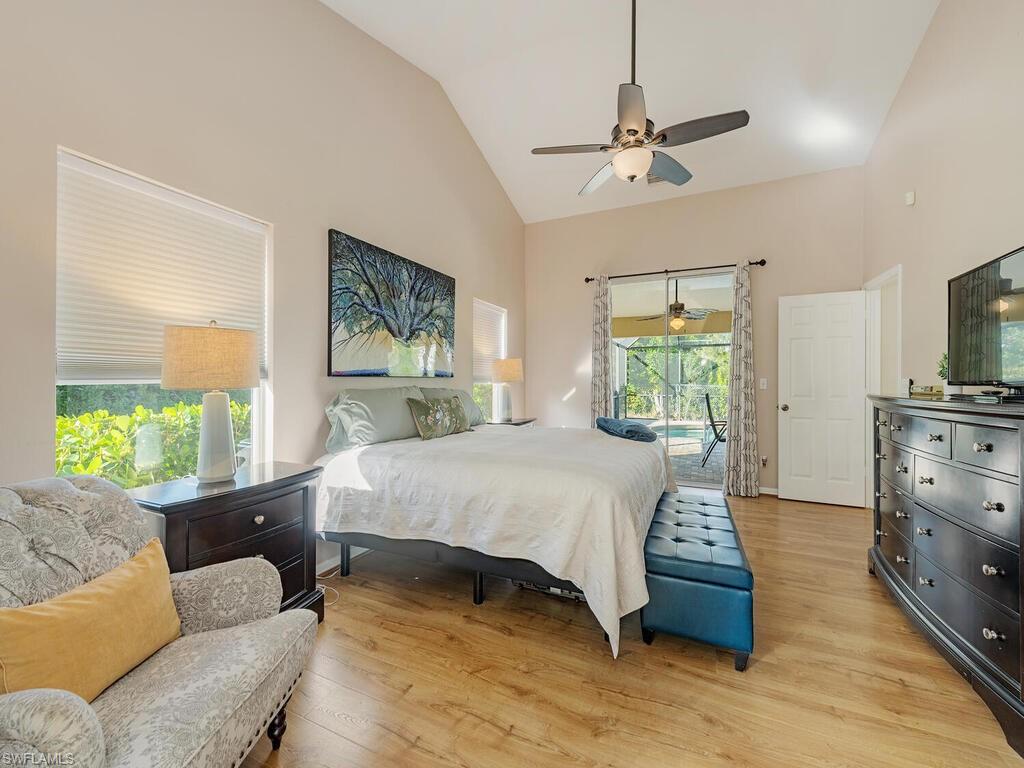 579 Raven Way Naples, FL 34110 - Photo 9 of 19 a bed room with a bed window and a television