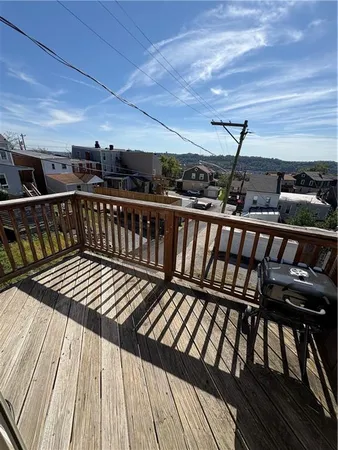 a kitchen with white cabinets a sink dishwasher and a stove with kitchen island