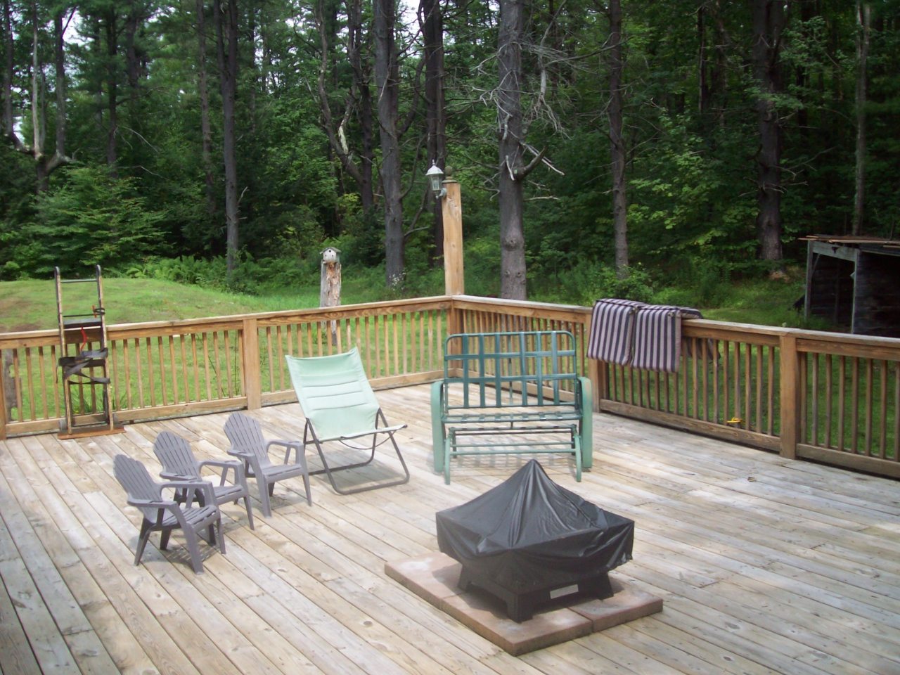 496 Dimmock Road Otis, MA 01253 - Photo 3 of 22 a view of balcony with wooden floor and outdoor seating