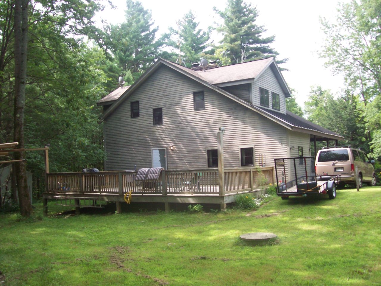 496 Dimmock Road Otis, MA 01253 - Photo 22 of 22 a view of a house with a yard
