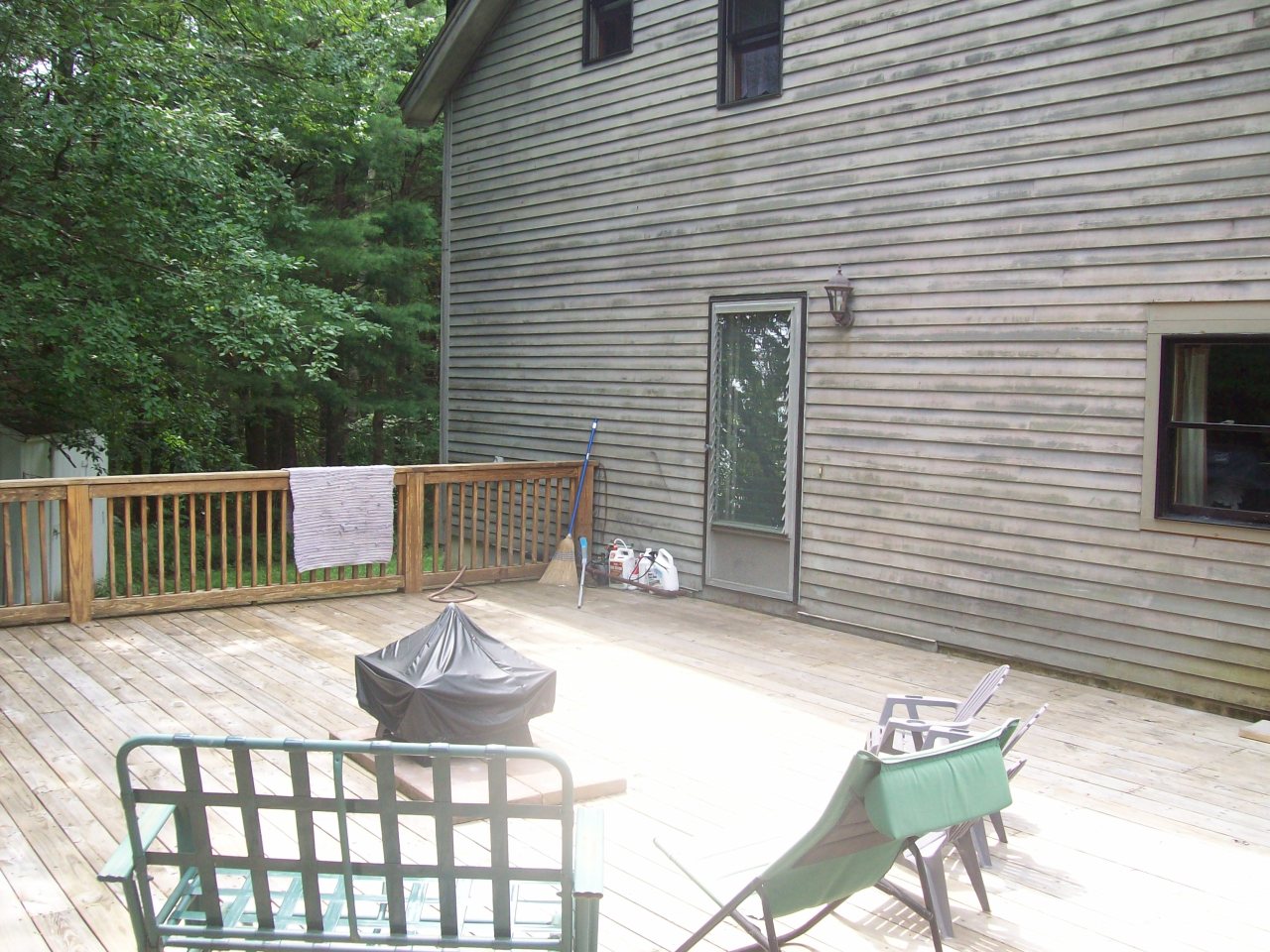 496 Dimmock Road Otis, MA 01253 - Photo 4 of 22 a view of a chair and table in the balcony