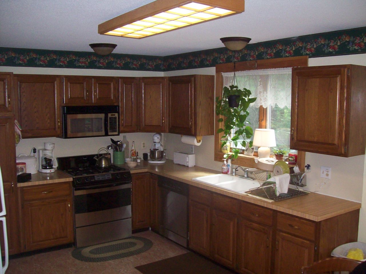 496 Dimmock Road Otis, MA 01253 - Photo 7 of 22 a kitchen with a sink and a stove top oven