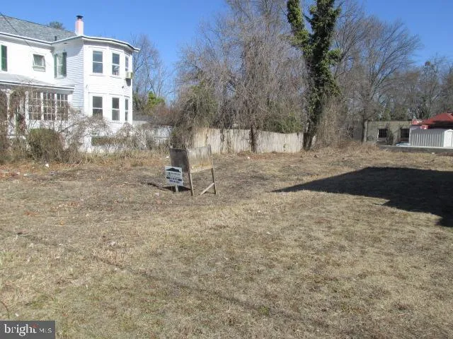 a backyard of a house with barbeque oven