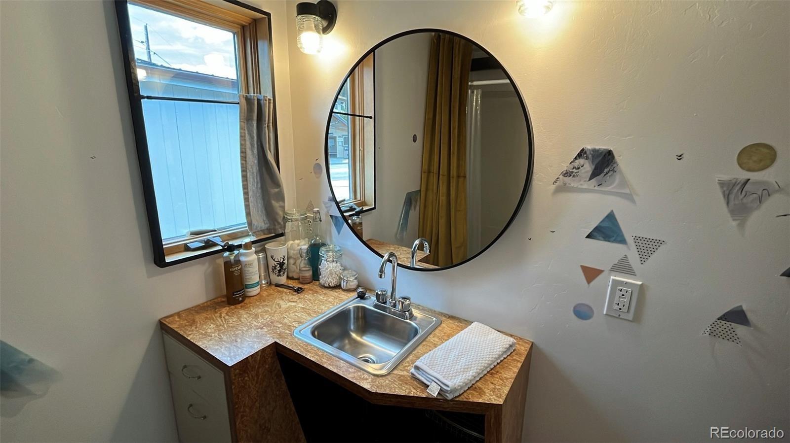 847 Airport Road Breckenridge, CO 80424 - Photo 12 of 24 a bathroom with a sink and a mirror