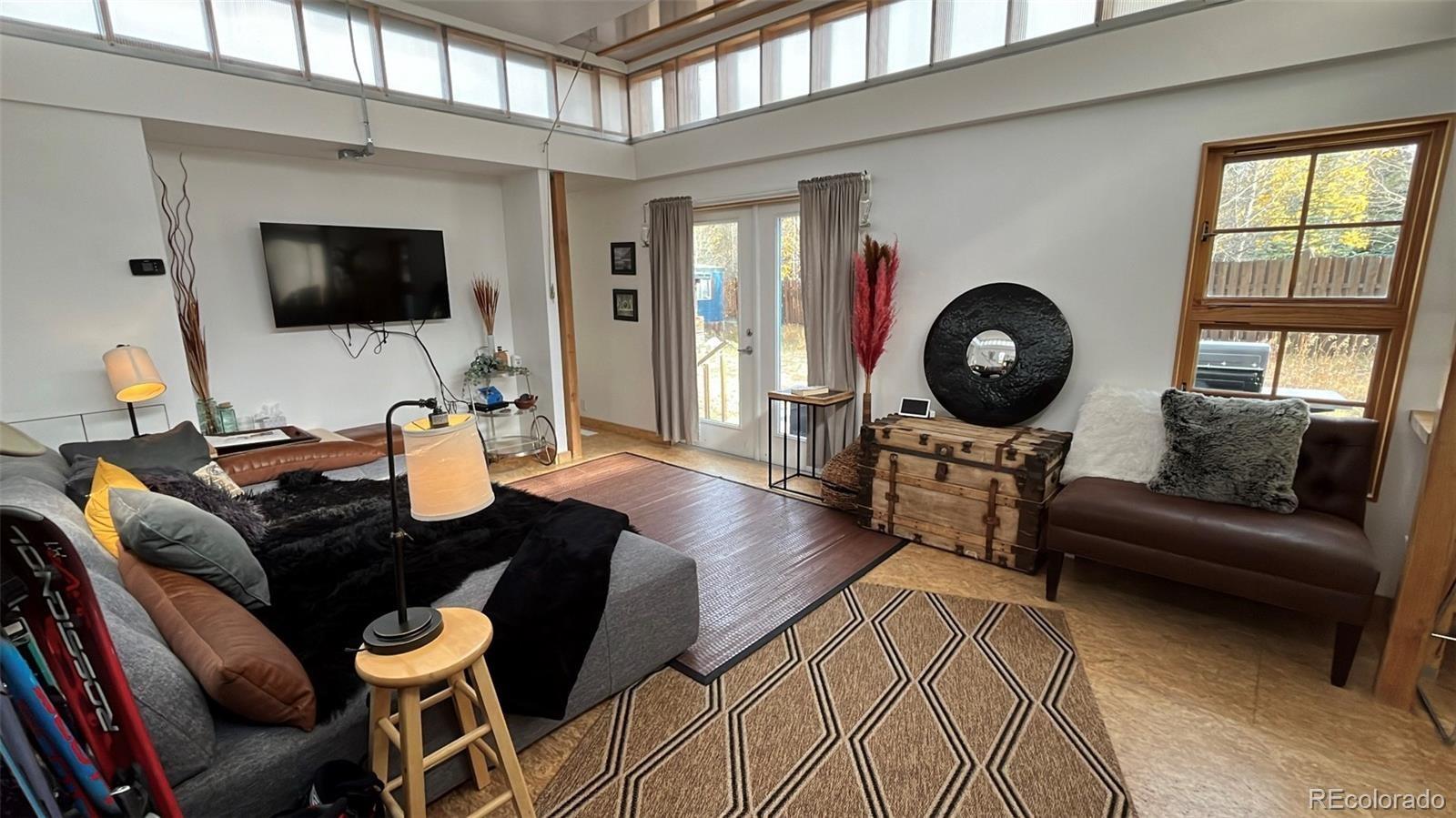 847 Airport Road Breckenridge, CO 80424 - Photo 24 of 24 a living room with furniture a flat screen tv and a window