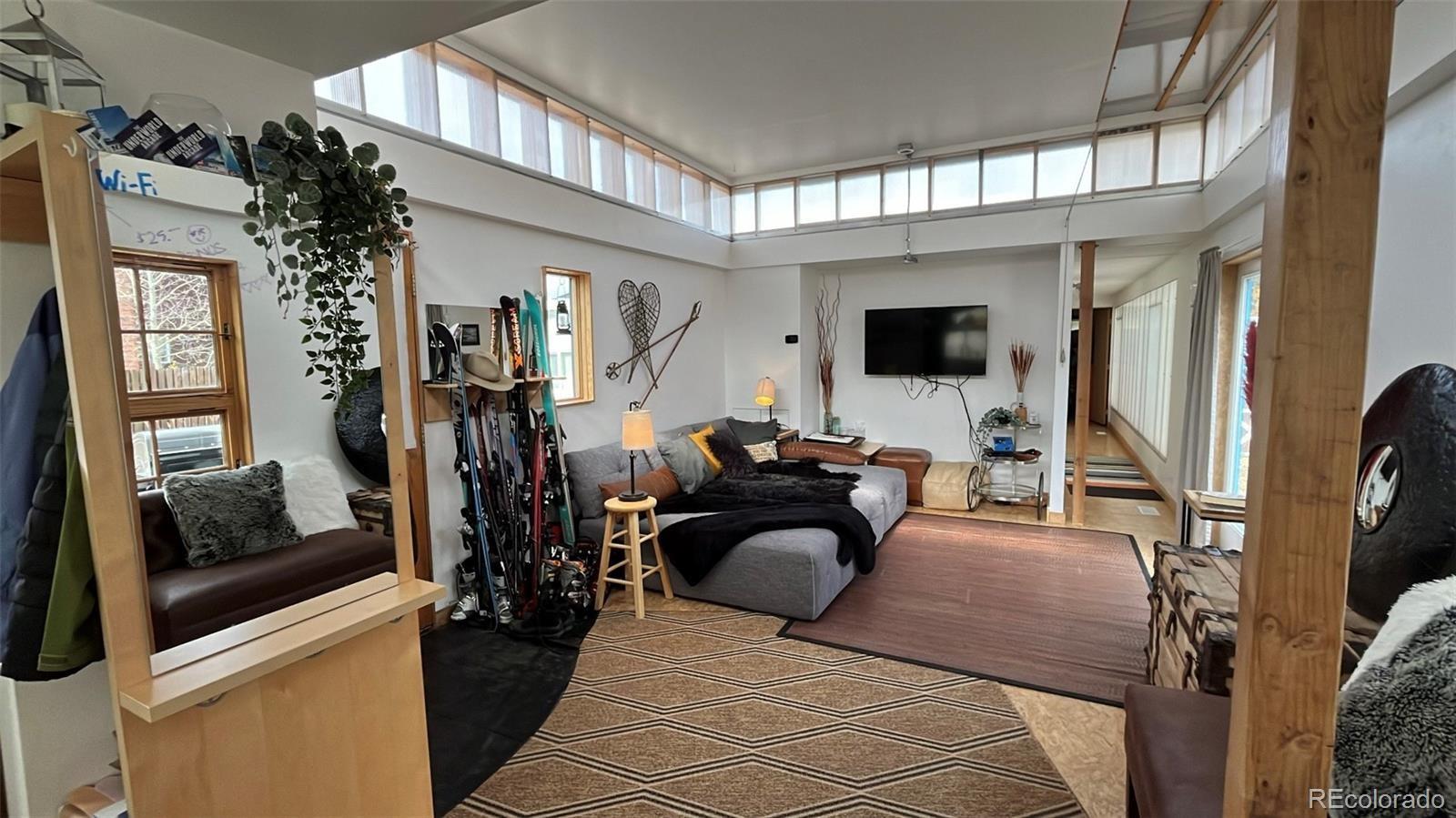 847 Airport Road Breckenridge, CO 80424 - Photo 7 of 24 a view of a livingroom with furniture and a flat screen tv