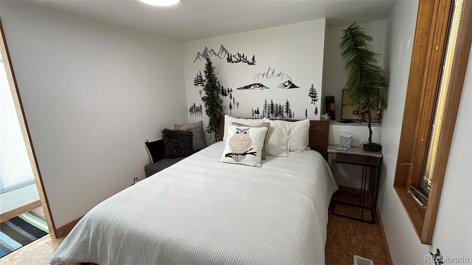 847 Airport Road Breckenridge, CO 80424 - Photo 9 of 24 a bed sitting in a bedroom next to a window