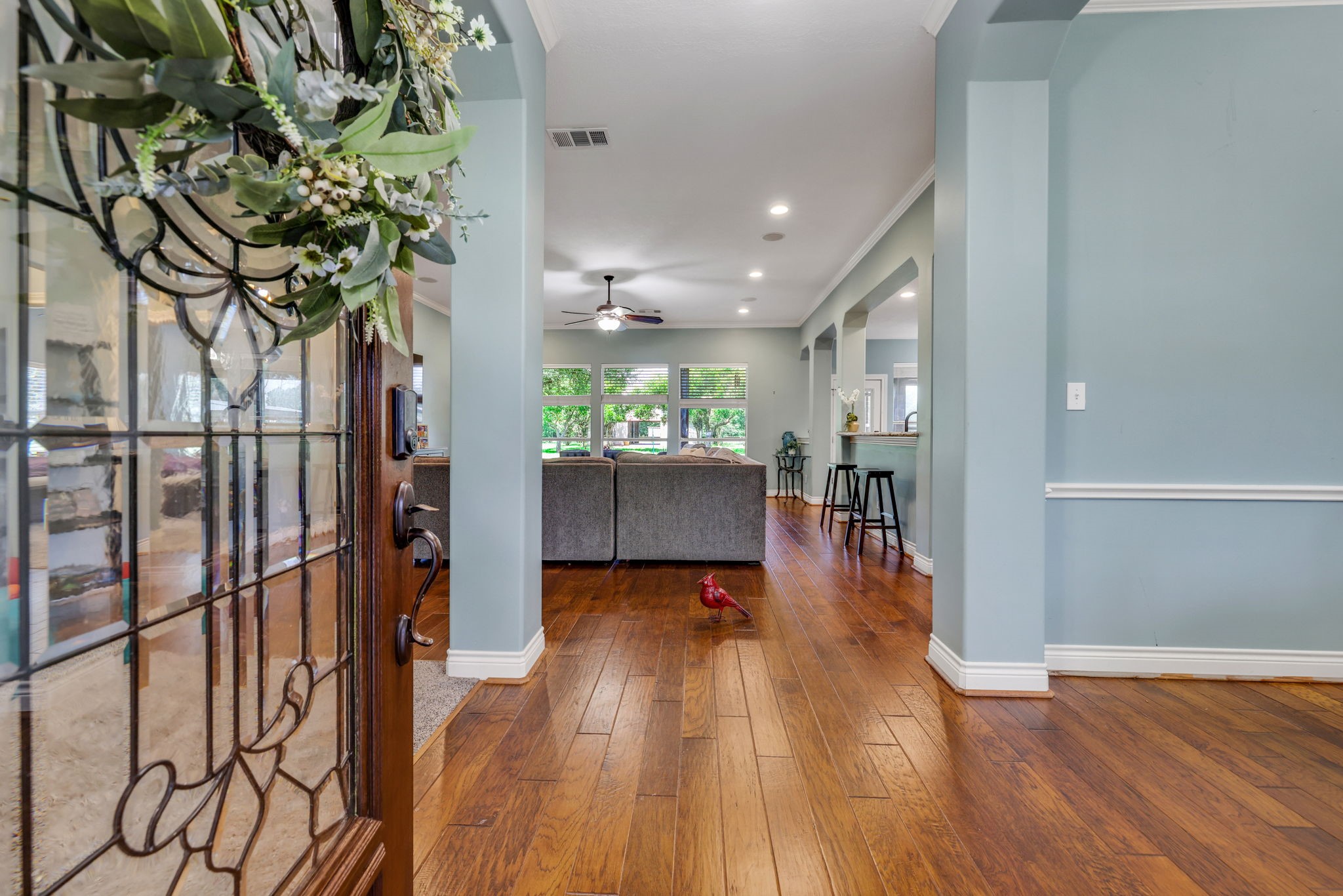 19407 Pine Tree Lane Waller, TX 77484 - Photo 11 of 39 a view of a hallway with wooden floor and a potted plant