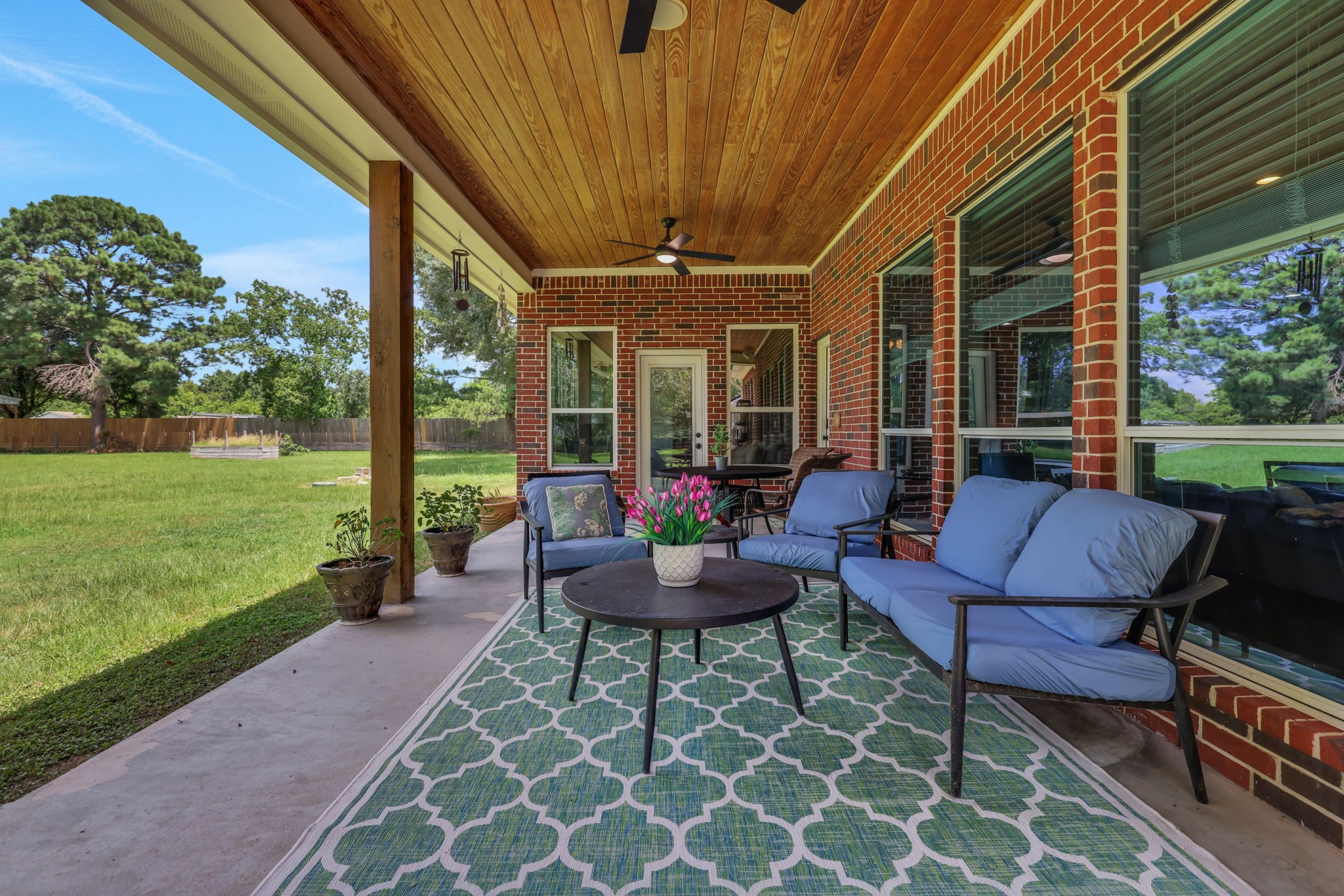 19407 Pine Tree Lane Waller, TX 77484 - Photo 2 of 39 a view of a patio with couches table and chairs with garden view