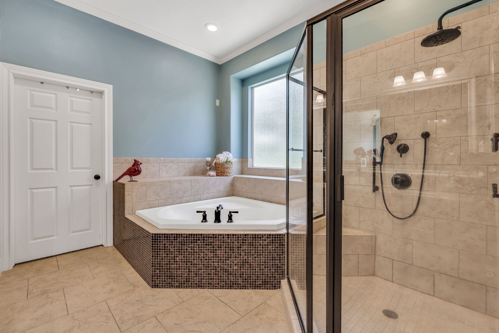 19407 Pine Tree Lane Waller, TX 77484 - Photo 25 of 39 a bathroom with a tub a sink and shower
