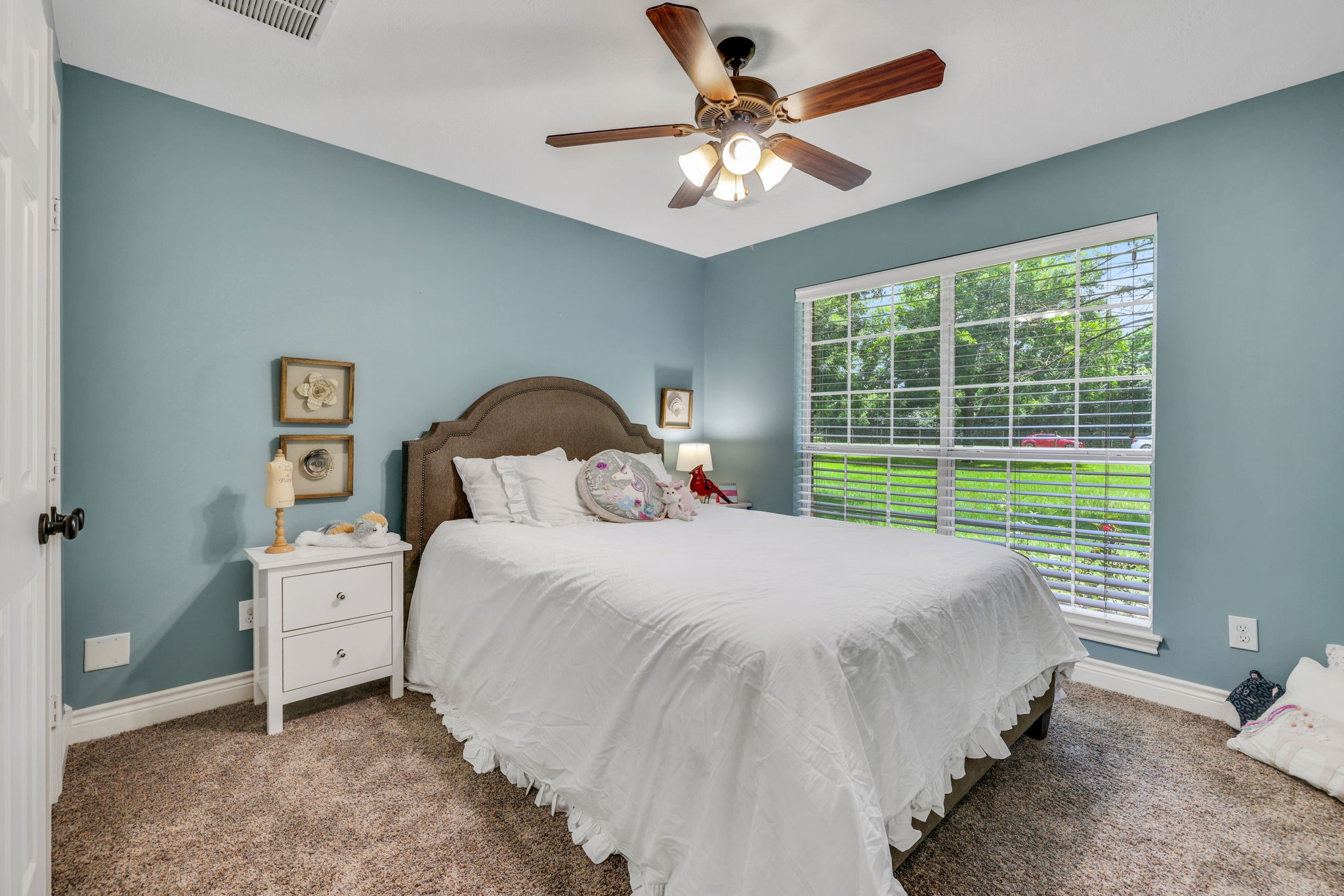 19407 Pine Tree Lane Waller, TX 77484 - Photo 26 of 39 a bedroom with a bed and a large window