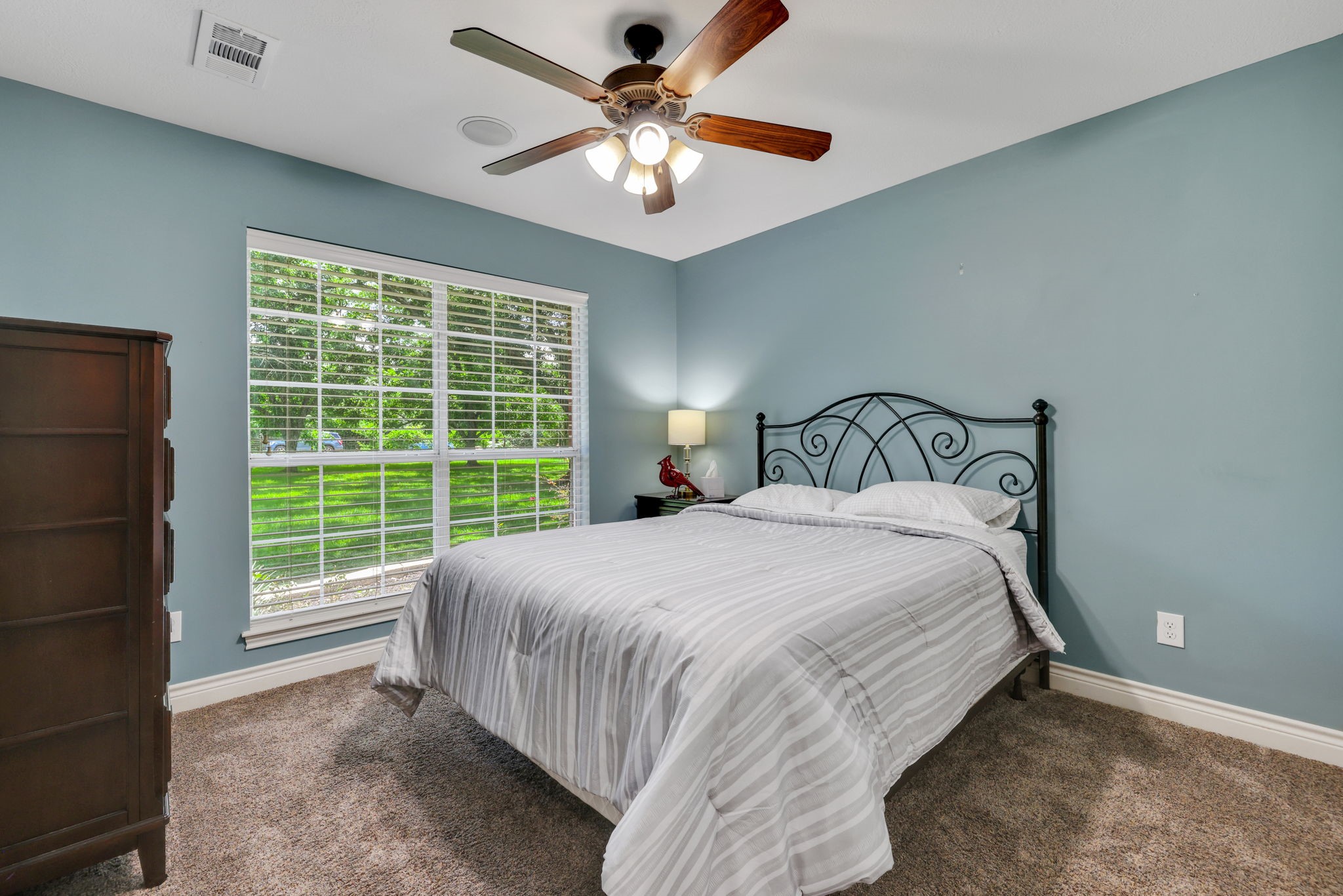 19407 Pine Tree Lane Waller, TX 77484 - Photo 28 of 39 a bedroom with a bed and a large window