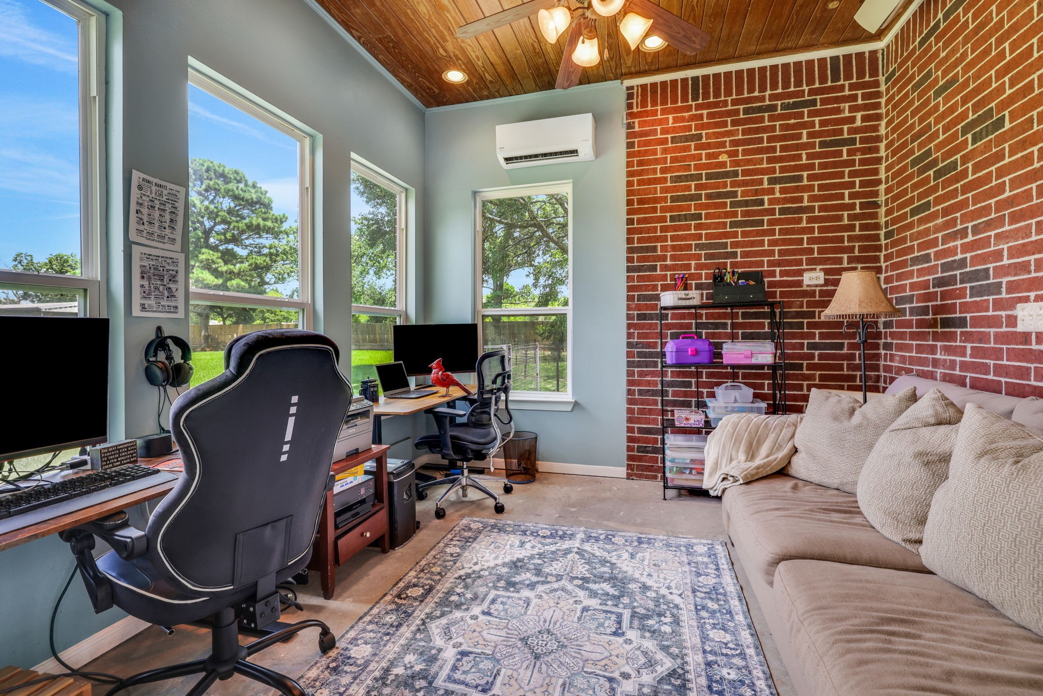 19407 Pine Tree Lane Waller, TX 77484 - Photo 31 of 39 a living room with furniture a flat screen tv and a window