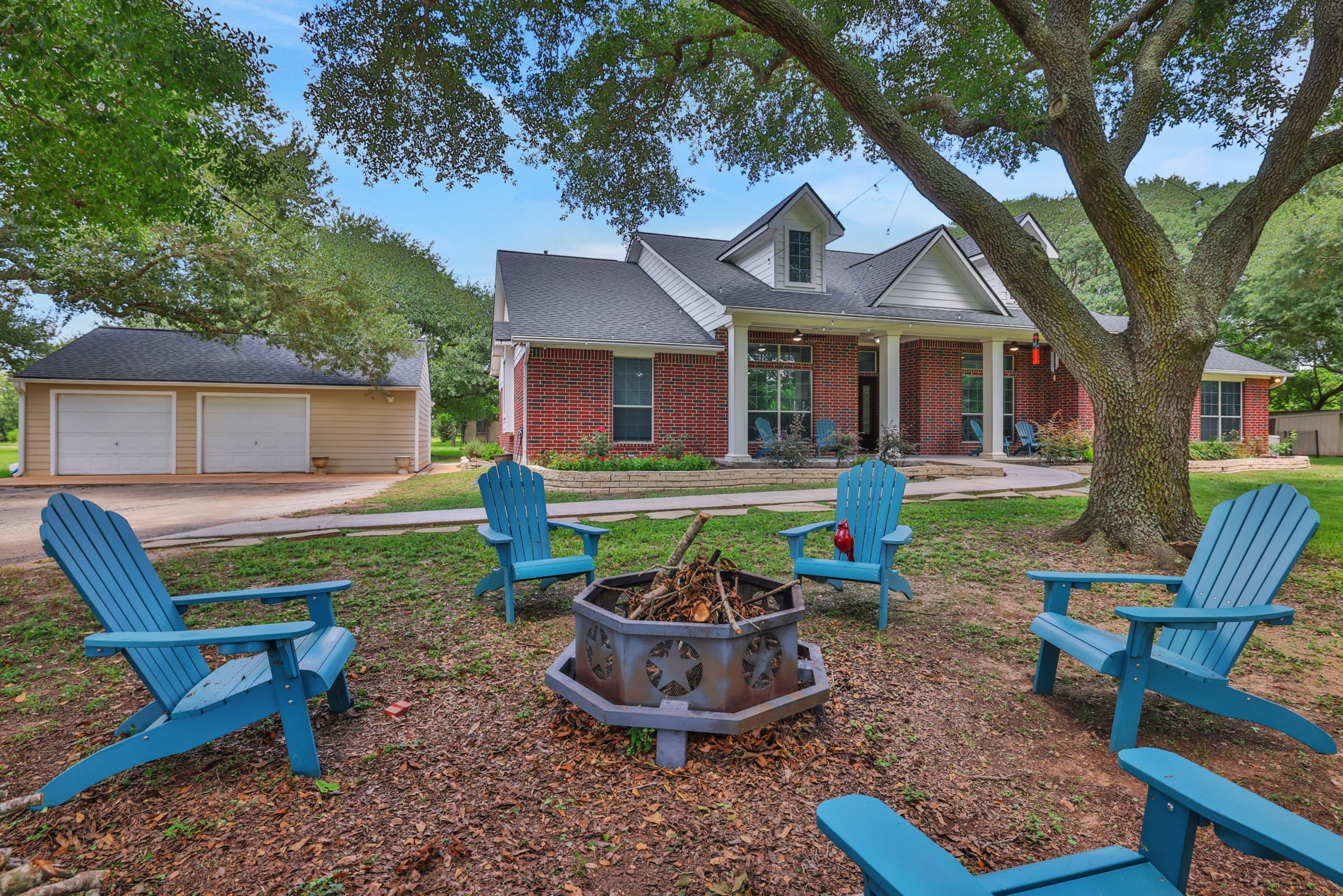 19407 Pine Tree Lane Waller, TX 77484 - Photo 9 of 39 a front view of a house with a garden