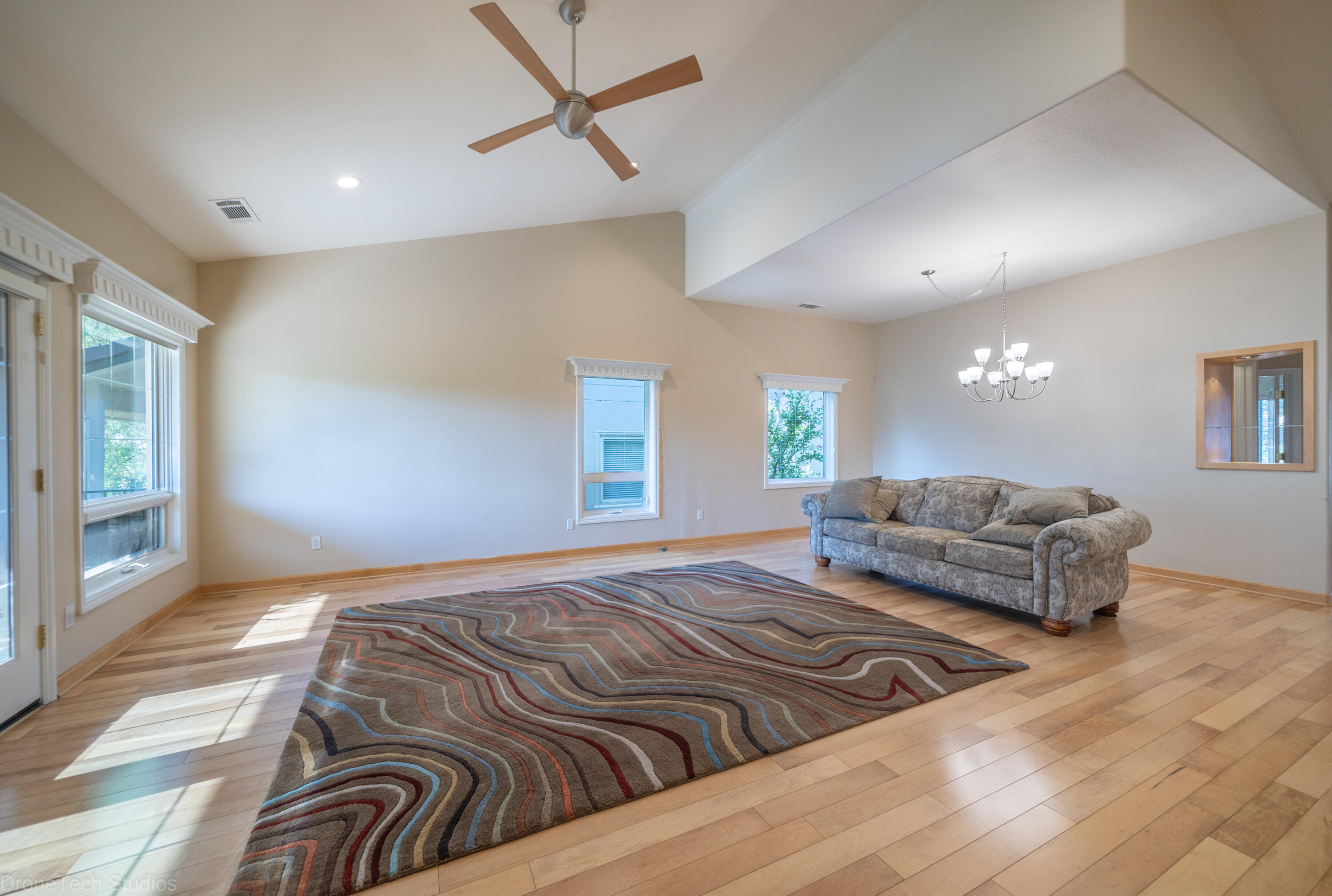 833 Cherryhill Trail Redding, CA 96003 - Photo 7 of 42 a bedroom with a large bed and a couch