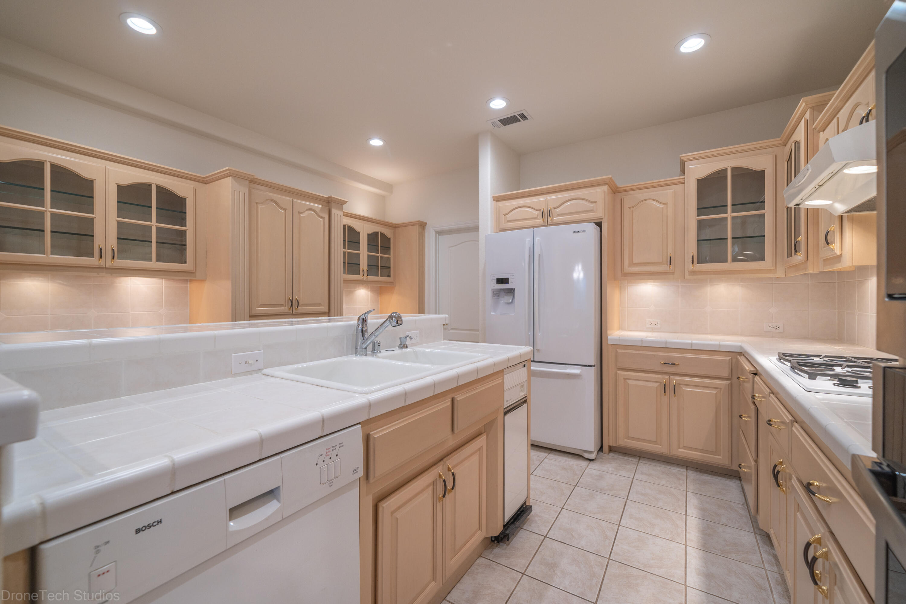 833 Cherryhill Trail Redding, CA 96003 - Photo 9 of 42 a kitchen with a sink stove and refrigerator