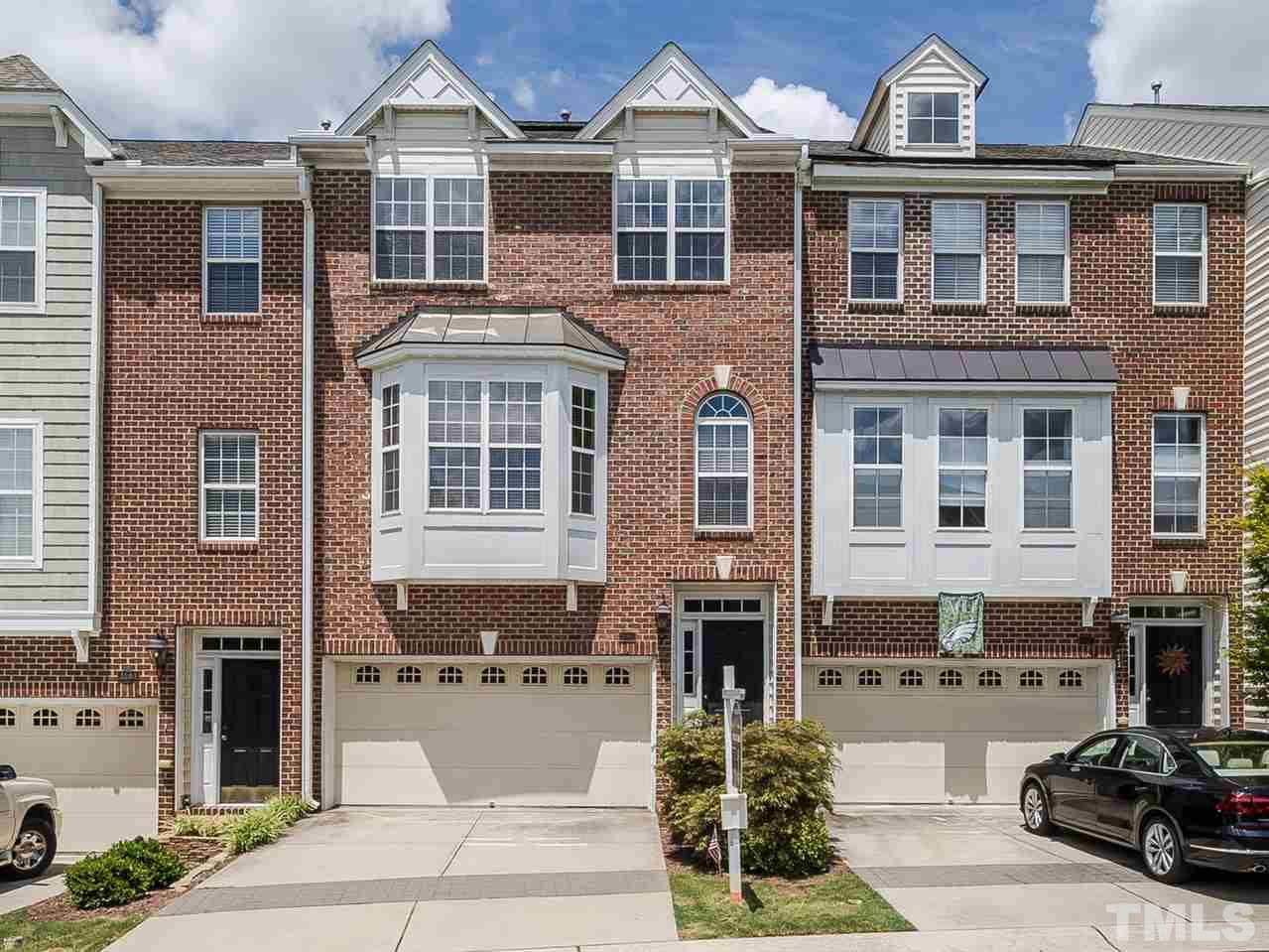 a front view of a building with many windows