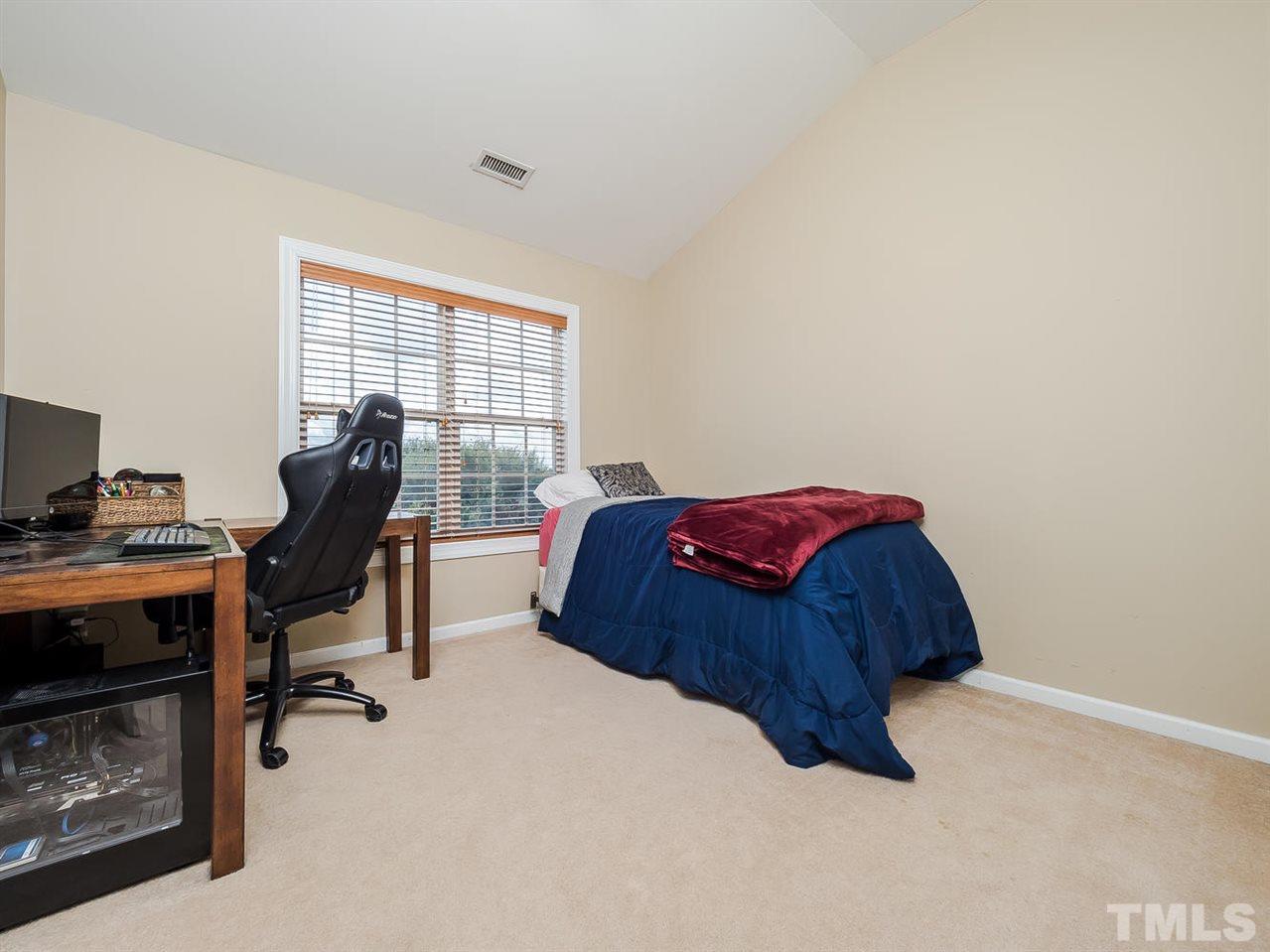 3005 Imperial Oaks Drive Raleigh, NC 27614 - Photo 13 of 25 a bedroom with a bed and a computer on a desk