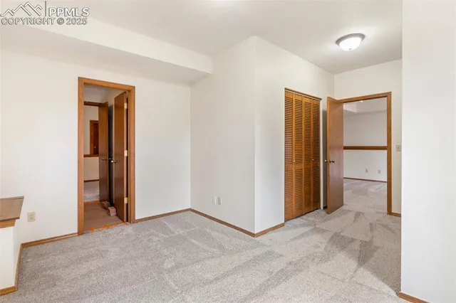 a view of a room with closet and wooden floor