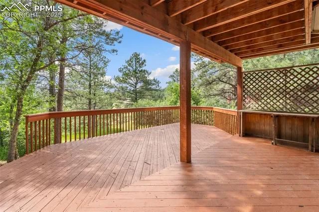 a balcony with trees in front of it