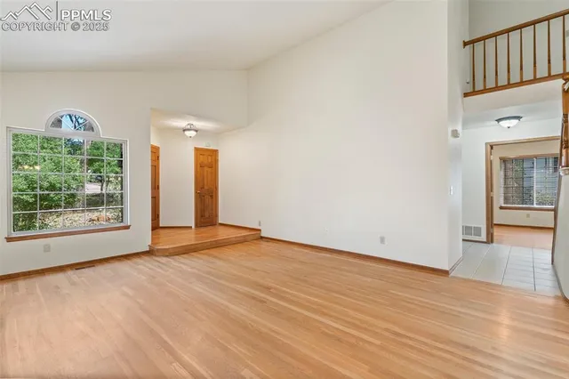 a view of an empty room with glass door