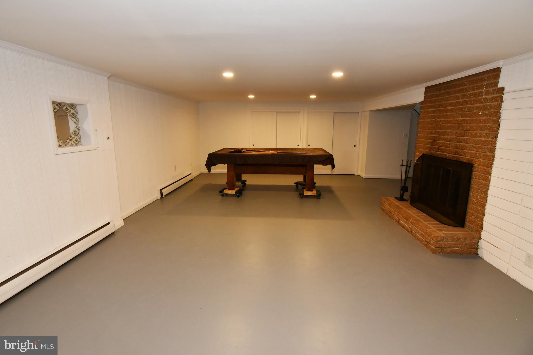437 Beechcroft Road Winchester, VA 22601 - Photo 33 of 52 a room with furniture and a fireplace