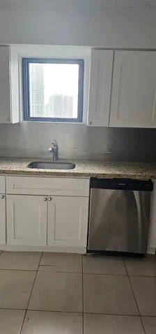 a kitchen with a stove and a microwave