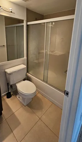 a bathroom with a sink vanity and mirror